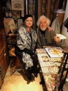 Photo of Anastasia Haysler and Osvaldo Menegazzi at his work table.