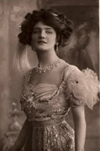 Black-and-white photo of an Edwardian-era woman in formal dress.