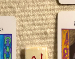 [Image description: A teaser screenshot of this week’s Insight from the Oracles, with just a hint of the cards and runes showing.]