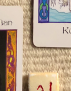 A screenshot showing a teaser bit of the cards and runes in the monthly overview spread.