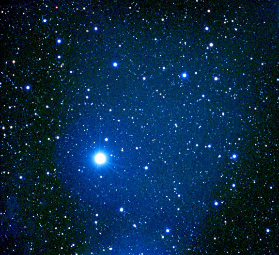 This image shows the star Alnilam lighting up the star NGC 1990. The photo was taken by Glen Youman of the website astrophotos.net. The photographer writes: "NGC 1990 surrounds the belt star Epsilon Orionis. This reflection nebula is of such low magnitude as to be invisible in all but the larger scopes. There are two very faint detached reflection nebulae in the lower left of the photo, my star charts do not identify these nebulae." Image source: https://commons.wikimedia.org/w/index.php?curid=1348675
