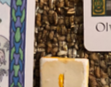 A teaser screenshot of the Monthly Overview spread, with just a hint of the cards and runes showing.