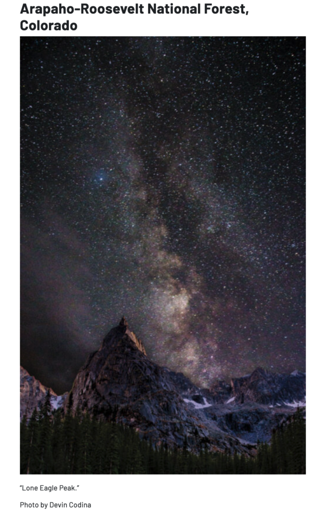 A photo of Lone Eagle Peak under a night sky.