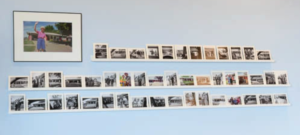 One wall of the gallery with the photos mounted on it.